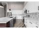 Modern kitchen with a large island and white cabinets at 25037 S Ribbonwood Dr, Sun Lakes, AZ 85248