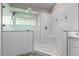 Walk-in shower with glass enclosure and built-in seat at 25037 S Ribbonwood Dr, Sun Lakes, AZ 85248