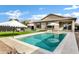 Inviting backyard oasis featuring a sparkling pool and patio furniture at 25422 S 228Th St, Queen Creek, AZ 85142