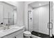 Contemporary bathroom with quartz countertop and a walk-in shower at 25422 S 228Th St, Queen Creek, AZ 85142