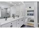 Modern bathroom with double vanity, large mirror, and a walk-in shower at 25422 S 228Th St, Queen Creek, AZ 85142