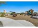 Charming community playground with a vintage tractor and play structures at 25422 S 228Th St, Queen Creek, AZ 85142