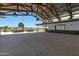 Large covered patio area with wooden beams and industrial lighting at 25422 S 228Th St, Queen Creek, AZ 85142