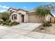 Single-story home with a two-car garage and desert landscaping at 25422 S 228Th St, Queen Creek, AZ 85142