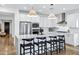 Modern kitchen with white cabinets, a large island, and stainless steel appliances at 25422 S 228Th St, Queen Creek, AZ 85142