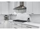 Kitchen with gas cooktop, white cabinets, and quartz countertops at 25422 S 228Th St, Queen Creek, AZ 85142