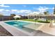 Clean lines and a refreshing pool in this backyard at 25422 S 228Th St, Queen Creek, AZ 85142