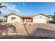 Single-story home with a two-car garage and desert landscaping at 2545 S Zinnia --, Mesa, AZ 85209