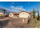 House exterior showcasing a driveway and mature desert plants at 2545 S Zinnia --, Mesa, AZ 85209