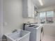 Bright laundry room, washer, dryer, and utility sink at 2545 S Zinnia --, Mesa, AZ 85209