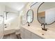 Bathroom with double vanity, black faucets, and oval mirrors at 2727 N Price Rd # 22, Chandler, AZ 85224