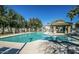 Inviting community pool with ample lounge chairs and covered seating area at 2727 N Price Rd # 22, Chandler, AZ 85224