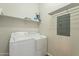 Laundry room with washer, dryer, and shelving at 2727 N Price Rd # 22, Chandler, AZ 85224