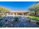 Landscaped backyard with a pool and a pathway at 29306 N 70Th Way, Scottsdale, AZ 85266