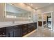 Elegant bathroom with double vanity, large mirror, and tile floors at 29306 N 70Th Way, Scottsdale, AZ 85266