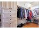 Large walk-in closet with shelving and hanging rods at 29306 N 70Th Way, Scottsdale, AZ 85266