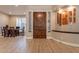 Interior entryway with wood flooring, a wood door and a dining area at 29306 N 70Th Way, Scottsdale, AZ 85266