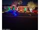 House exterior at night with festive holiday lighting at 29306 N 70Th Way, Scottsdale, AZ 85266