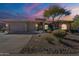 One-story home with a three-car garage and landscaped front yard at 29306 N 70Th Way, Scottsdale, AZ 85266