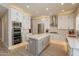 Modern kitchen with white cabinets, stainless steel appliances, and large island at 29306 N 70Th Way, Scottsdale, AZ 85266