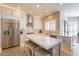 Modern kitchen with white cabinets, stainless steel appliances, and large island at 29306 N 70Th Way, Scottsdale, AZ 85266