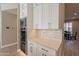 Modern kitchen with white cabinets and built-in appliances at 29306 N 70Th Way, Scottsdale, AZ 85266