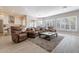 Open living room with a view of the kitchen, hardwood floors and comfortable seating at 29306 N 70Th Way, Scottsdale, AZ 85266