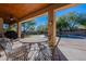 Covered patio with seating area and a view of the pool at 29306 N 70Th Way, Scottsdale, AZ 85266