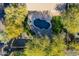 An aerial view of a kidney-shaped pool and surrounding patio at 29306 N 70Th Way, Scottsdale, AZ 85266