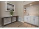 Modern wet bar with white cabinets and quartz countertop at 29306 N 70Th Way, Scottsdale, AZ 85266