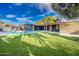 Expansive backyard with a refreshing pool and lush green lawn at 2942 N 81St Pl, Scottsdale, AZ 85251