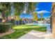 Spacious backyard boasts a large pool, putting green, and mature trees at 2942 N 81St Pl, Scottsdale, AZ 85251