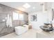 Spa-like bathroom with soaking tub and marble accents at 2942 N 81St Pl, Scottsdale, AZ 85251