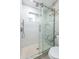 Modern shower with glass enclosure and marble tile at 2942 N 81St Pl, Scottsdale, AZ 85251