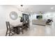 Modern dining room with a concrete table and dark wood chairs at 2942 N 81St Pl, Scottsdale, AZ 85251