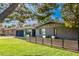 Mid-century modern home with gray brick facade and a modern fence at 2942 N 81St Pl, Scottsdale, AZ 85251