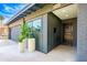 Attractive front entrance featuring a well-lit doorway, complemented by potted plants and a clean, modern aesthetic at 2942 N 81St Pl, Scottsdale, AZ 85251