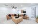 Modern living room with brown leather sofas and a wooden coffee table at 2942 N 81St Pl, Scottsdale, AZ 85251