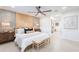Serene main bedroom featuring a stylish accent wall, modern furnishings, and ample natural light, offering a relaxing retreat at 2942 N 81St Pl, Scottsdale, AZ 85251