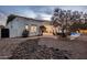 Landscaped backyard with rock features and pathway leading to pool at 3038 E Waterman Way, Gilbert, AZ 85297