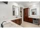 Elegant bathroom with a large vanity, modern fixtures, and a walk-in shower at 3038 E Waterman Way, Gilbert, AZ 85297