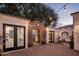 Charming courtyard with stone archway, string lights, and comfortable seating at 3038 E Waterman Way, Gilbert, AZ 85297