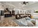 Open concept living room with a kitchen view and stylish rug at 3038 E Waterman Way, Gilbert, AZ 85297