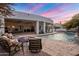 Inviting pool and patio area with fire pit and comfortable seating at 3038 E Waterman Way, Gilbert, AZ 85297