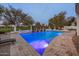 Inviting pool area with a water feature and comfortable seating at 3038 E Waterman Way, Gilbert, AZ 85297