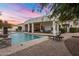 Stunning pool and patio area with seating and outdoor lighting at 3038 E Waterman Way, Gilbert, AZ 85297