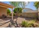 Desert landscape with gravel, cactus plants, and a covered patio at 3531 E Utopia Rd, Phoenix, AZ 85050