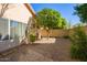 Backyard with gravel, a small tree, and a seating area at 3531 E Utopia Rd, Phoenix, AZ 85050