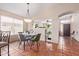 Dining area adjacent to the kitchen, featuring a glass-top table at 3531 E Utopia Rd, Phoenix, AZ 85050