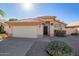 One-story house with a two-car garage and desert landscaping at 3531 E Utopia Rd, Phoenix, AZ 85050